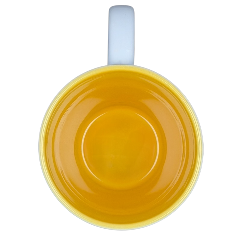 Winnie the Pooh Storybook Mug Disney Store featuring a vibrant yellow interior for cheerful sipping