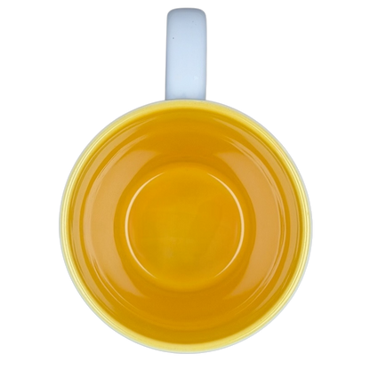 Winnie the Pooh Storybook Mug Disney Store featuring a vibrant yellow interior for cheerful sipping