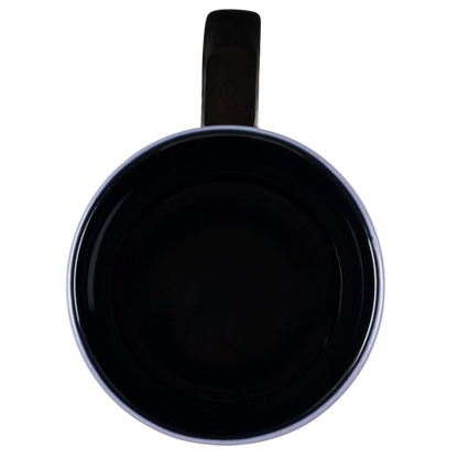 Top view of empty black glossy Tinker Bell Mornings Disney vintage mug with handle at top on black background