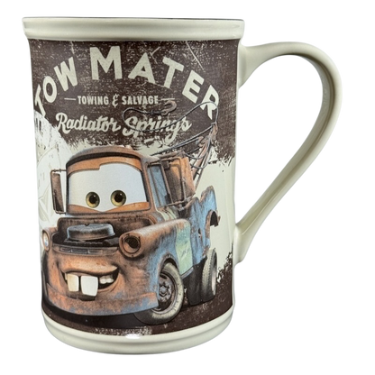 Disney Tow Mater cup vintage featuring the character Tow Mater from Radiator Springs with a rustic design