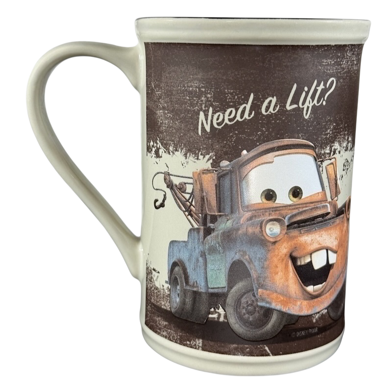 Disney Tow Mater cup vintage featuring Tow Mater with Need a Lift text and rustic design