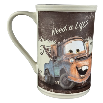 Disney Tow Mater cup vintage featuring Tow Mater with Need a Lift text and rustic design