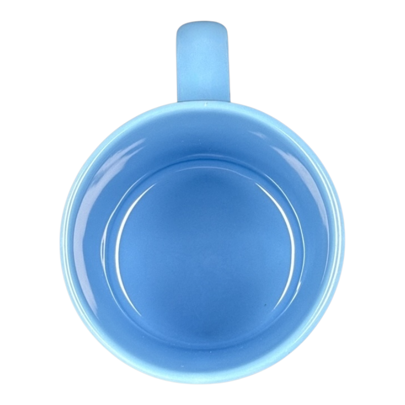 Top view of Disney vintage Mickey Mouse starring tonight curtain call mug light blue ceramic interior and handle