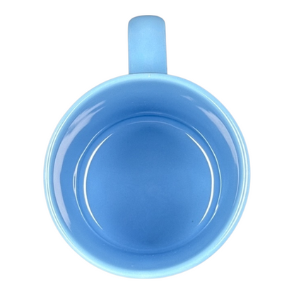 Top view of Disney vintage Mickey Mouse starring tonight curtain call mug light blue ceramic interior and handle