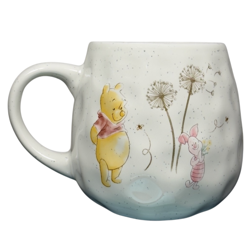Disney Winnie the Pooh dimpled ceramic collectible mug featuring Pooh and Piglet with dandelion design