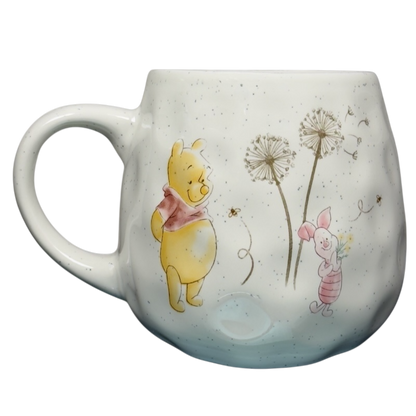 Disney Winnie the Pooh dimpled ceramic collectible mug featuring Pooh and Piglet with dandelion design