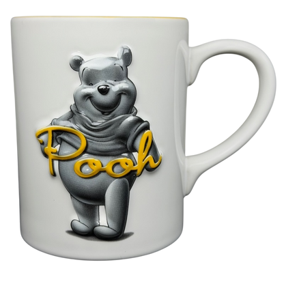 Winnie The Pooh Embossed Mug Disney featuring a cheerful Pooh design in gray and yellow