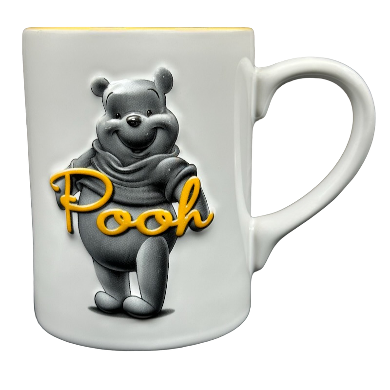 Winnie The Pooh Embossed Mug Disney featuring a playful Pooh design in white ceramic