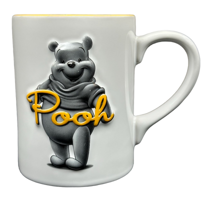 Winnie The Pooh Embossed Mug Disney featuring a playful Pooh design in white ceramic