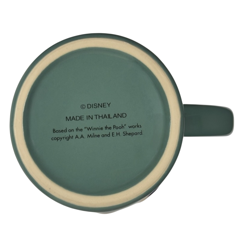 Disney Winnie the Pooh stuck in tree vintage mug teal bottom view showing copyright and Made in Thailand