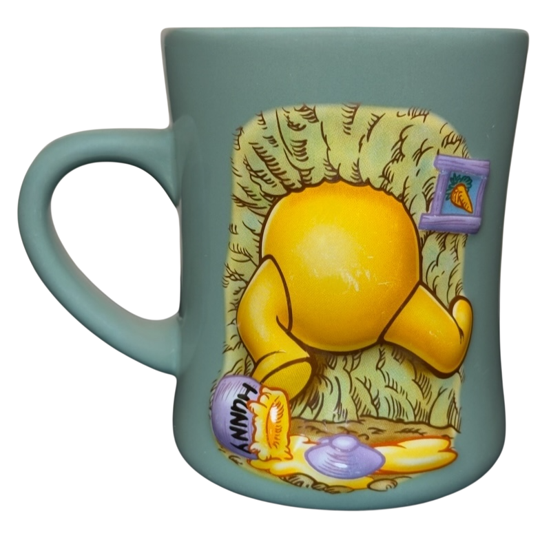 Winnie the Pooh stuck in tree vintage mug teal Disney ceramic cup showing Pooh stuck with spilled hunny pot design
