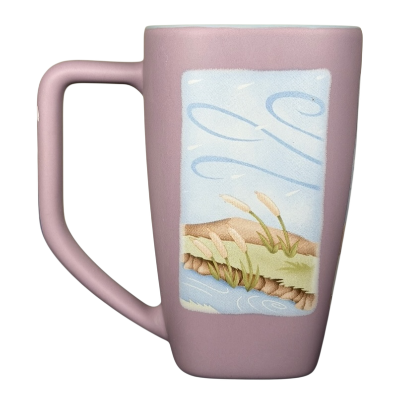 Disneyland Eeyore collectible mug featuring a pastel design and a scenic landscape illustration