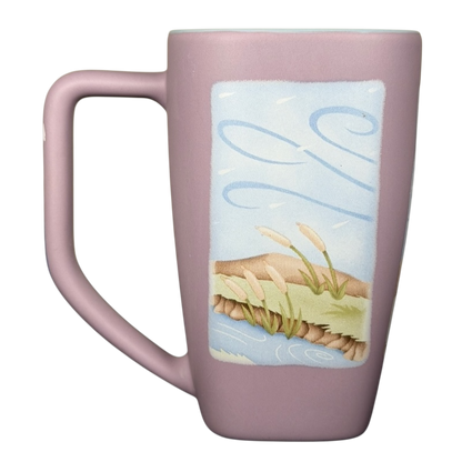 Disneyland Eeyore collectible mug featuring a pastel design and a scenic landscape illustration