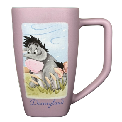 Disneyland Eeyore collectible mug featuring Eeyore with a pastel background and a comfortable handle