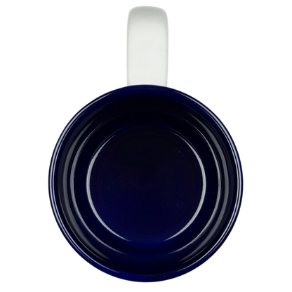 Inside view of a navy blue Disneyland Happiest Homecoming on Earth mug with a white handle