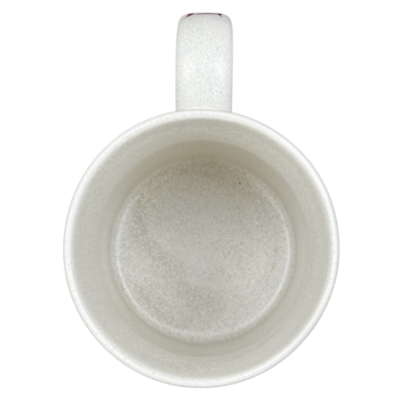 Interior view of a Disneyland Minnie Mouse VIP vintage mug in white with a textured finish