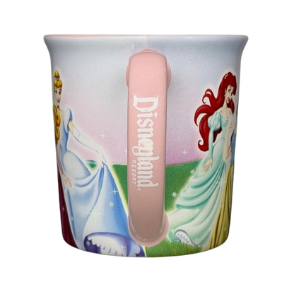 Disney Princess Castle Disneyland Resort Mug featuring Cinderella and Ariel in colorful designs