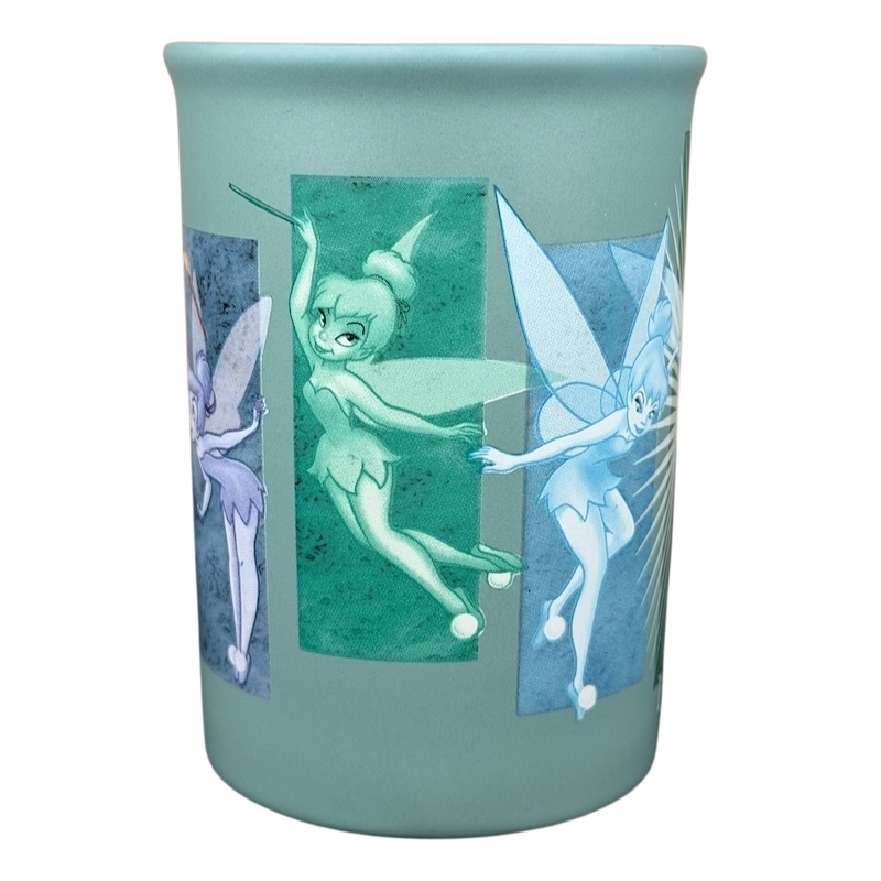 Tinker Bell Tink 5 Poses Disneyland Mug featuring colorful fairy designs on a mint green background