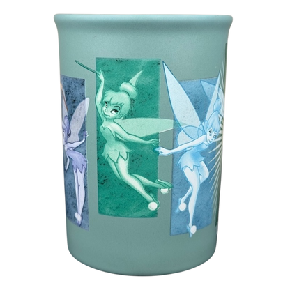 Tinker Bell Tink 5 Poses Disneyland Mug featuring colorful fairy designs on a mint green background