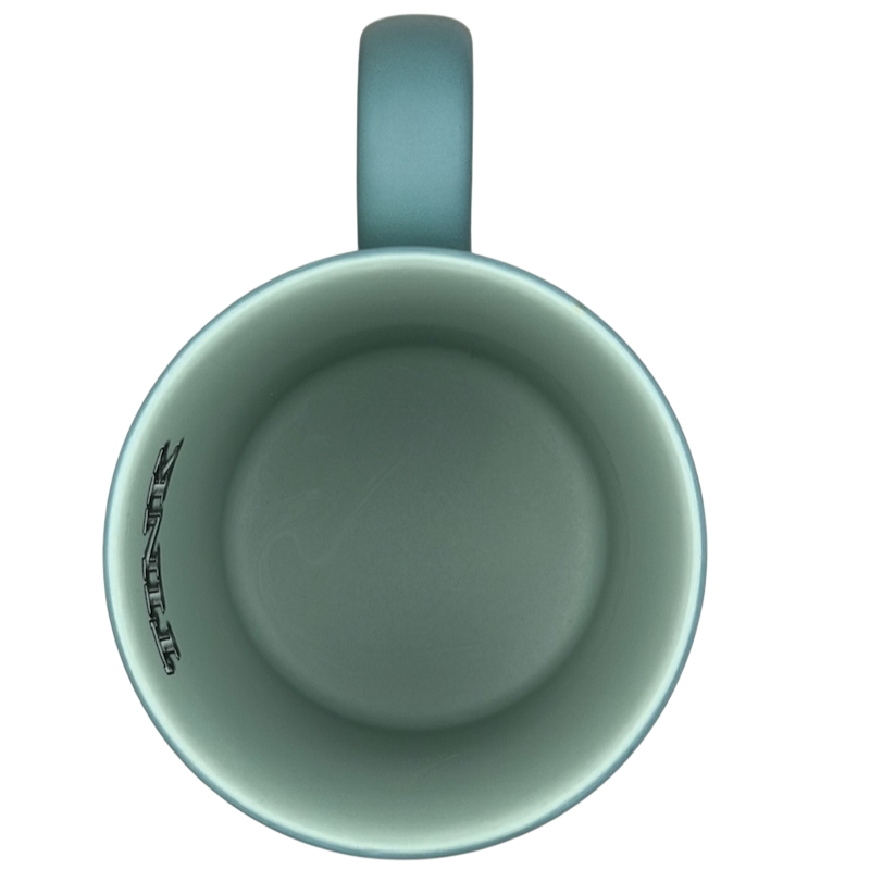 Inside view of Tinker Bell Tink 5 Poses Disneyland Mug with a soft blue interior and logo