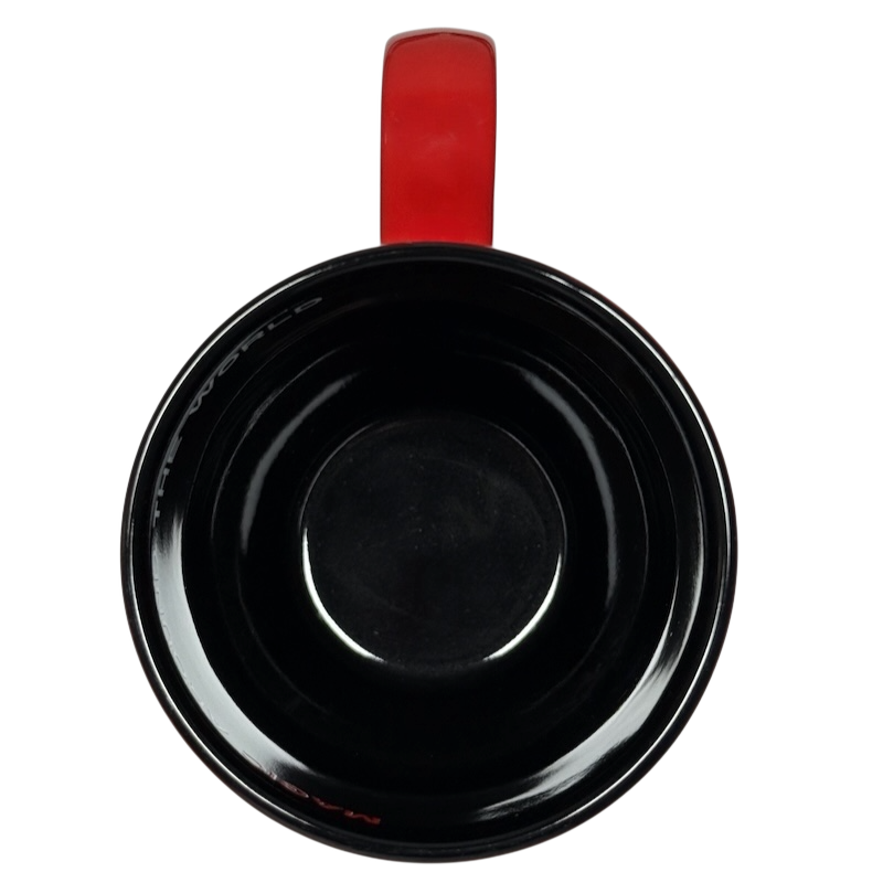 Top view of Disney Mickey Mouse Magic Around The World vintage mug with black interior and red handle