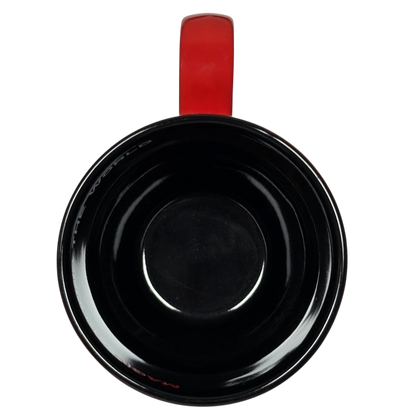 Top view of Disney Mickey Mouse Magic Around The World vintage mug with black interior and red handle