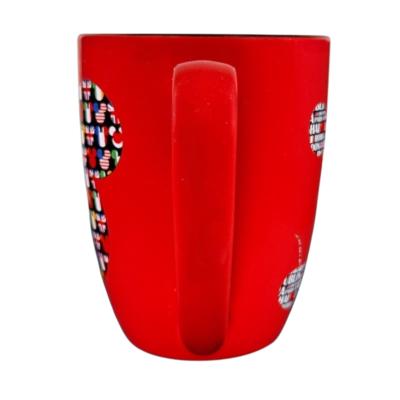 Red Disney Mickey Mouse Magic Around The World vintage mug showing handle and part of colorful Mickey design