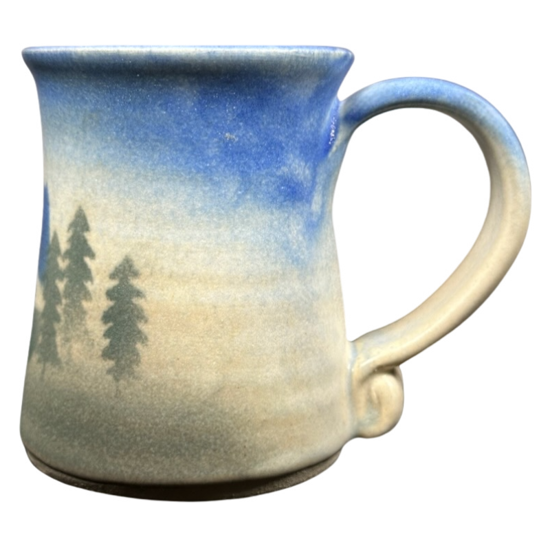 Dulcie Lindsoe-Johansen Mt. Hood pottery mug with a scenic forest design and a unique curved handle
