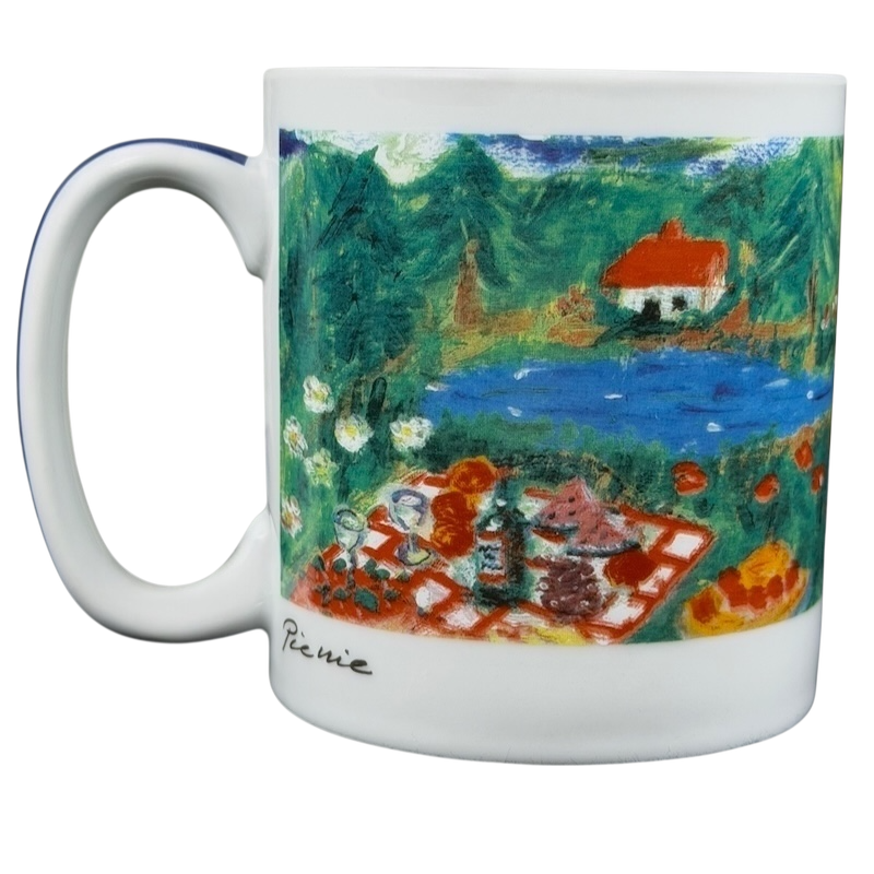 Eddie Bauer countryside picnic mug featuring a vibrant outdoor scene with a pond and picnic setup