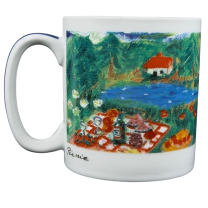 Eddie Bauer countryside picnic mug featuring a vibrant outdoor scene with a pond and picnic setup