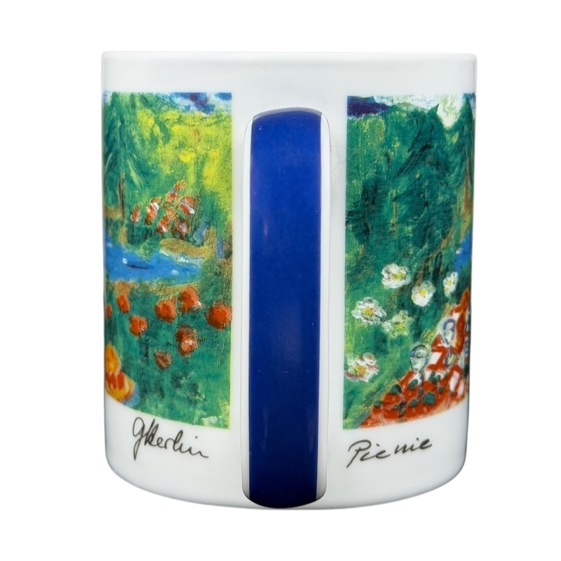 Eddie Bauer countryside picnic mug featuring colorful nature scenes and a blue handle