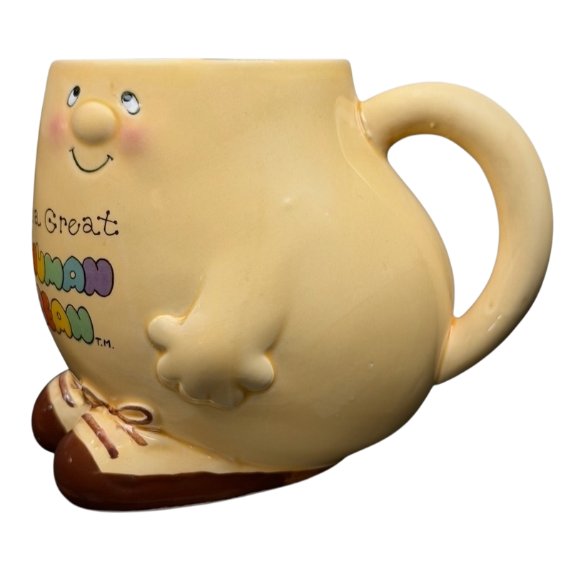Vintage 1981 Enesco Human Beans Figural Mug featuring a smiling character design and colorful logo