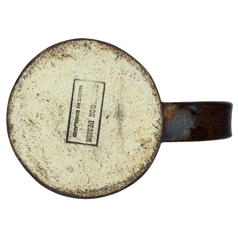 Bottom view of an English Pottery Lion Mug from Quantock Design showcasing its label and rustic finish