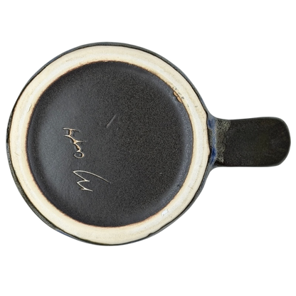 Bottom view of the Five Fish Mara Mexico mug showcasing its unique ceramic finish and craftsmanship.