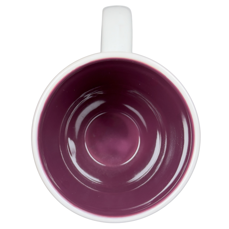 Floral Cat Silhouette Coffee Mug with a glossy white exterior and a deep purple interior