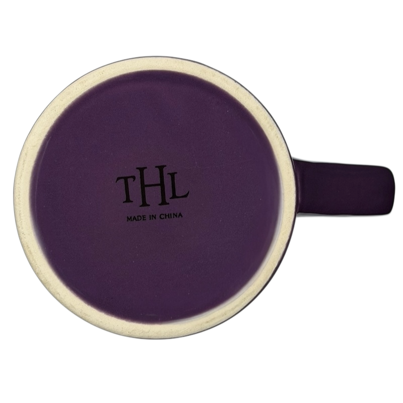 Top view of a THL collectible purple mug featuring the phrase Follow Your Heart.