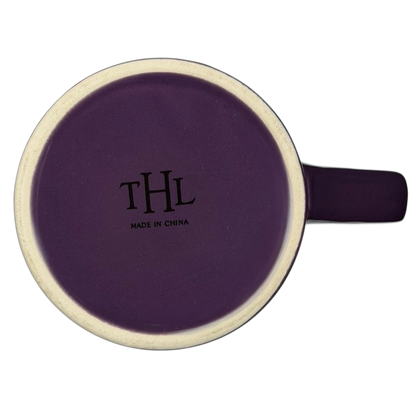 Top view of a THL collectible purple mug featuring the phrase Follow Your Heart.