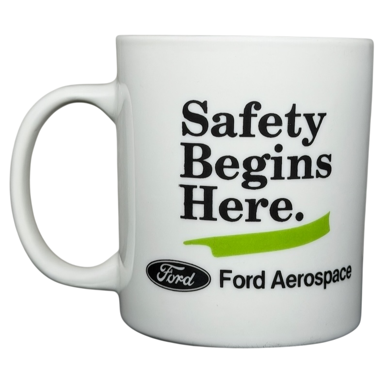 Ford Aerospace vintage mug featuring the phrase Safety Begins Here and classic branding