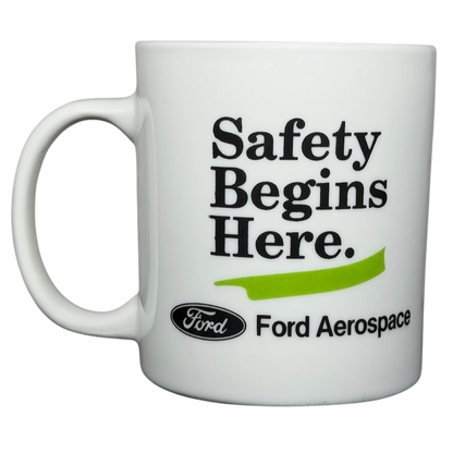 Ford Aerospace vintage mug featuring the phrase Safety Begins Here and classic branding
