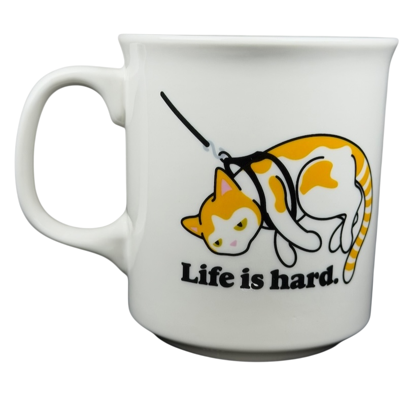 Life is Hard Orange Tabby Cat Mug Fred featuring a cute cat illustration and humorous quote