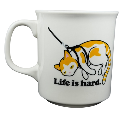 Life is Hard Orange Tabby Cat Mug Fred featuring a cute cat illustration and humorous quote