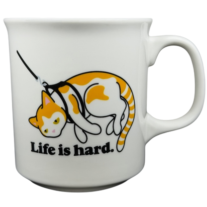Life is Hard Orange Tabby Cat Mug Fred featuring a playful cat design and humorous text