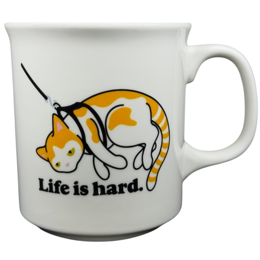 Life is Hard Orange Tabby Cat Mug Fred featuring a playful cat design and humorous text