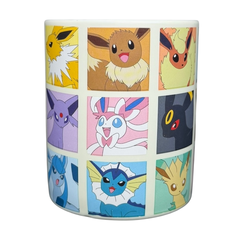 Eevee & Eeveelutions Grid Mug Game Freak featuring various Eevee evolutions in colorful artwork