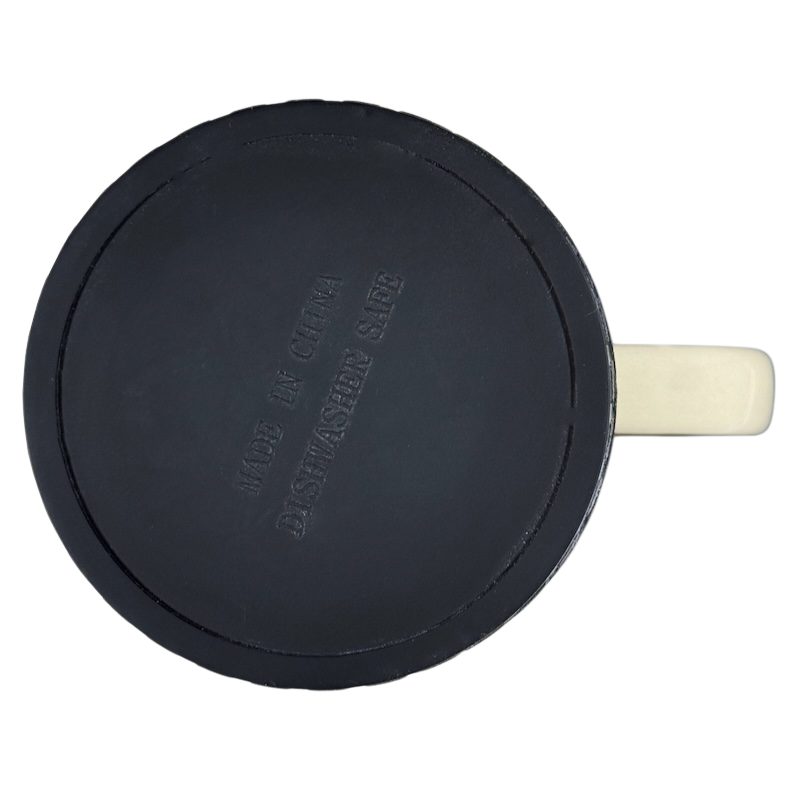 Top view of I'd Rather Be In My Garage rubber tire mug showing black tire style base with cream handle