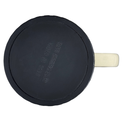 Top view of I'd Rather Be In My Garage rubber tire mug showing black tire style base with cream handle