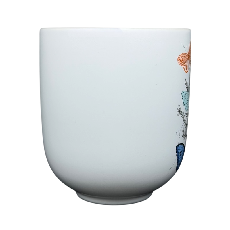 Geninne's Art butterflies mug featuring colorful butterfly illustrations on a white background
