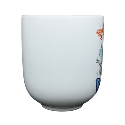 Geninne's Art butterflies mug featuring colorful butterfly illustrations on a white background