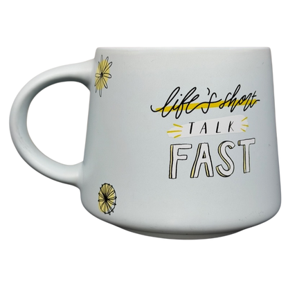 Gilmore Girls Lukes Diner Mug with a white design featuring the phrase life's short talk fast and floral accents