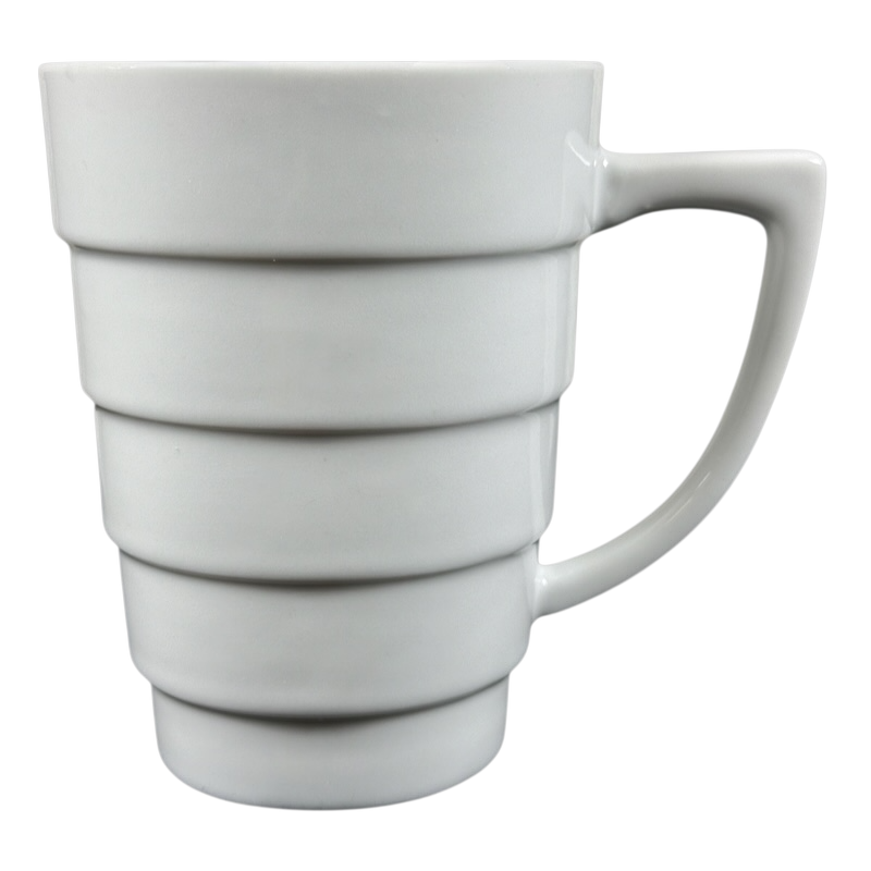 Krups white ceramic Frank Lloyd Wright vintage Guggenheim mug with stepped spiral bands and angular handle